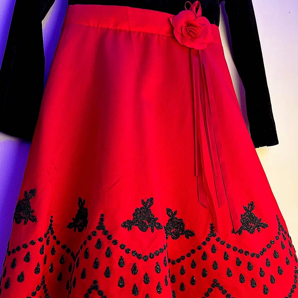 Girls Christmas red and black A-line dress with beaded embellishments.